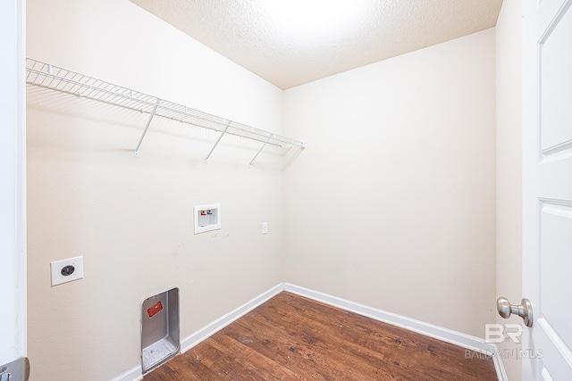 laundry room with washer hookup, a textured ceiling, dark hardwood / wood-style floors, and electric dryer hookup