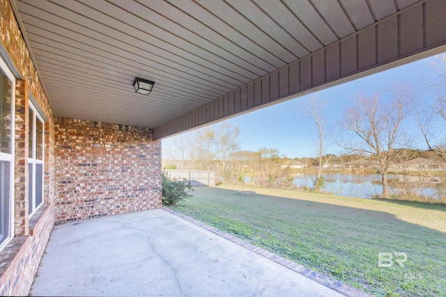 view of patio with a water view