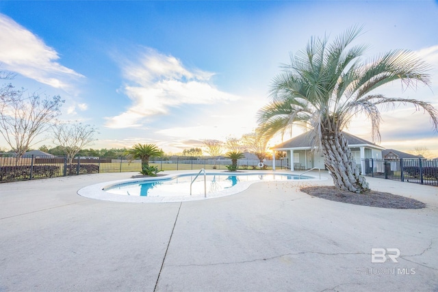 view of swimming pool with a patio area