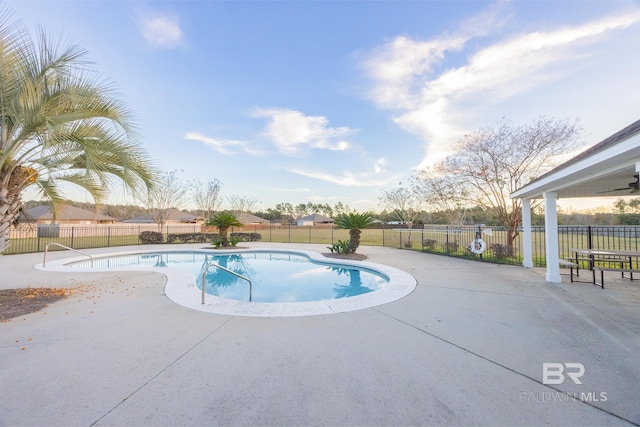 view of swimming pool featuring a patio area