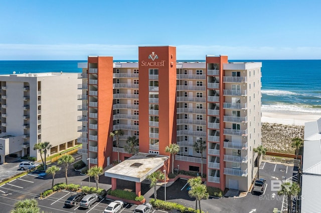1117 W Beach Blvd Unit 201, Gulf Shores, AL 36542 - view of apartment building / complex with uncovered parking and a water view