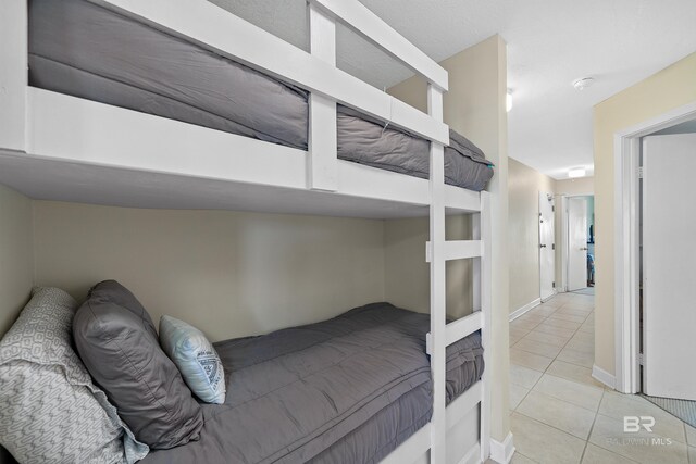 1117 W Beach Blvd Unit 201, Gulf Shores, AL 36542 - bedroom with tile patterned flooring