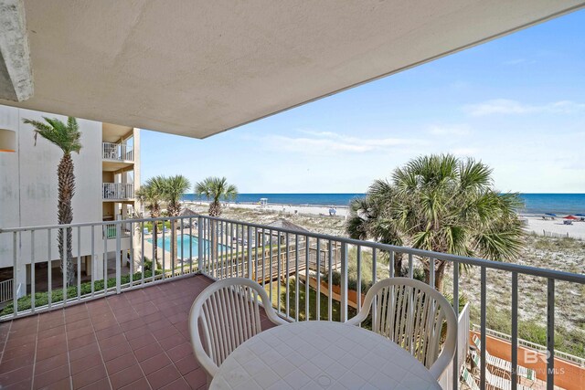 1117 W Beach Blvd Unit 201, Gulf Shores, AL 36542 - balcony with view of water and beach and view of pool area