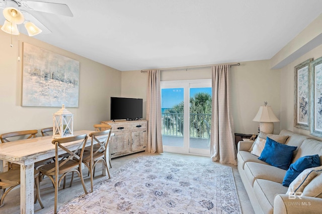 1117 W Beach Blvd Unit 201, Gulf Shores, AL 36542 - living room featuring a ceiling fan