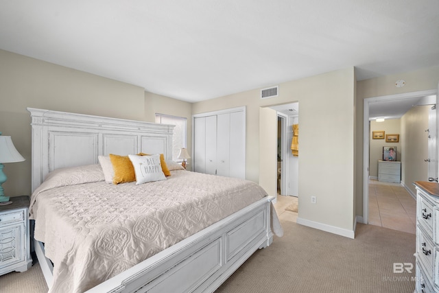 1117 W Beach Blvd Unit 201, Gulf Shores, AL 36542 - bedroom with a closet, light colored carpet, and baseboards