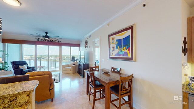 dining room with ceiling fan and crown molding