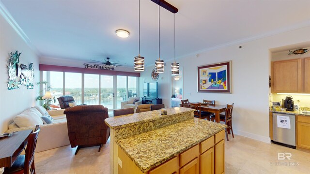 kitchen with light stone counters, a kitchen island, pendant lighting, ceiling fan, and stainless steel dishwasher