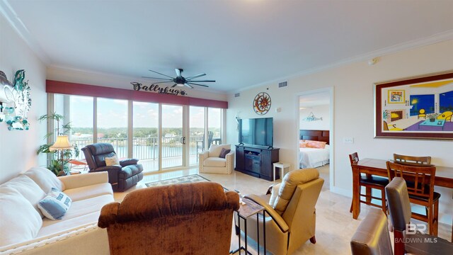 living room with crown molding and ceiling fan