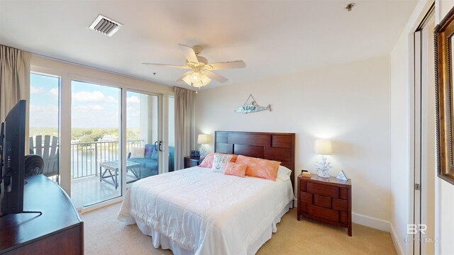 carpeted bedroom featuring ceiling fan and access to exterior