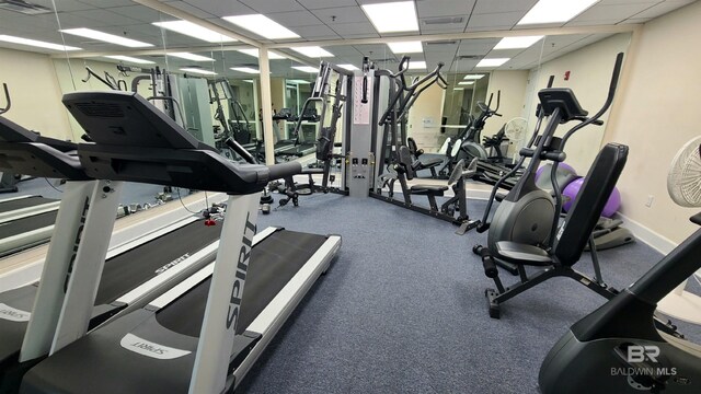 gym featuring a drop ceiling