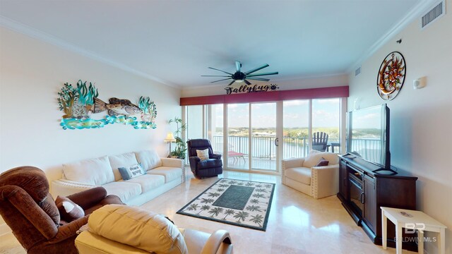 living room featuring ceiling fan and crown molding