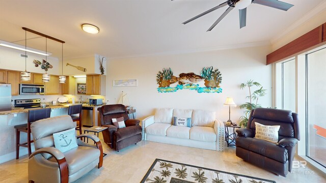 living room with crown molding and ceiling fan