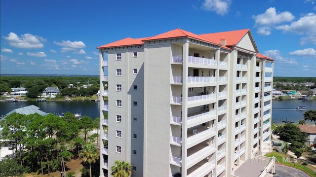 view of building exterior with a water view