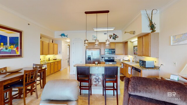 kitchen with pendant lighting, stainless steel appliances, light stone counters, and crown molding