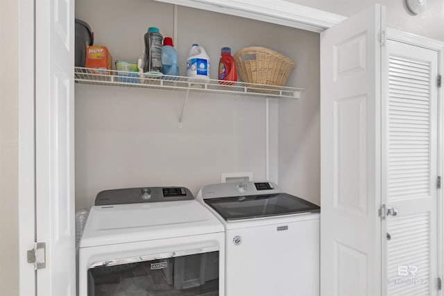 laundry room featuring washer and dryer and laundry area