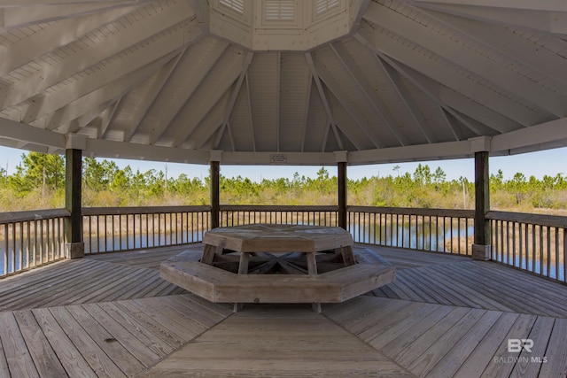 deck with a water view and a gazebo