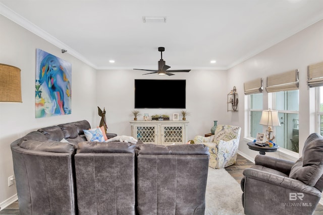 living room featuring a ceiling fan, dark wood-style flooring, crown molding, and baseboards