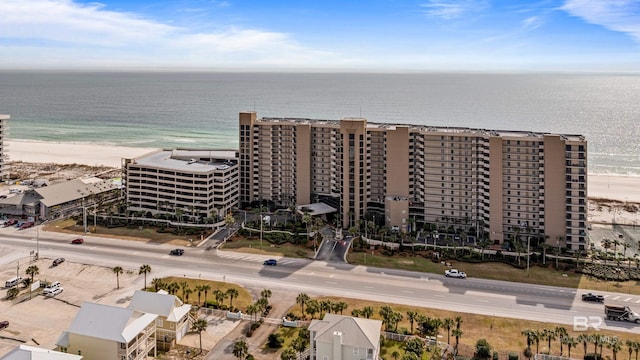 bird's eye view with a water view and a view of the beach