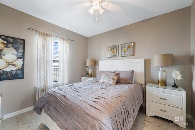 bedroom featuring ceiling fan and light tile patterned floors