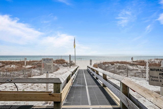 view of property's community with a view of the beach and a water view