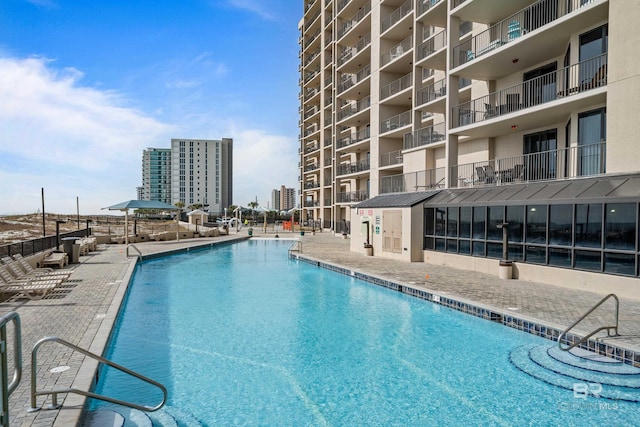 view of pool featuring a patio