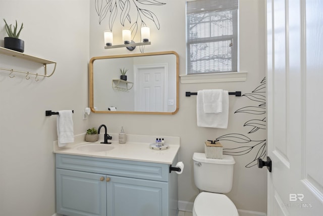 half bathroom featuring toilet and vanity