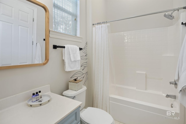 bathroom with shower / bathtub combination with curtain, vanity, and toilet