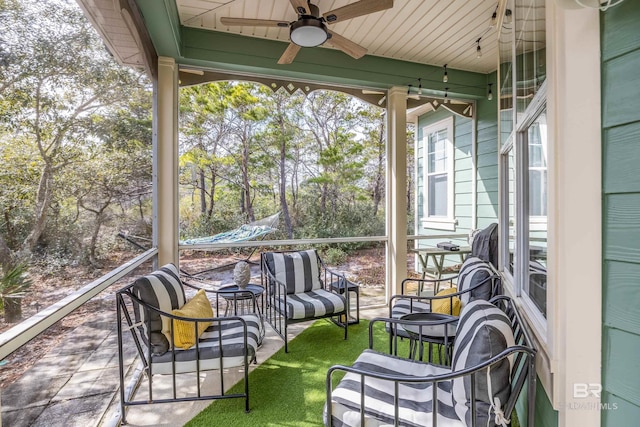 sunroom / solarium with ceiling fan