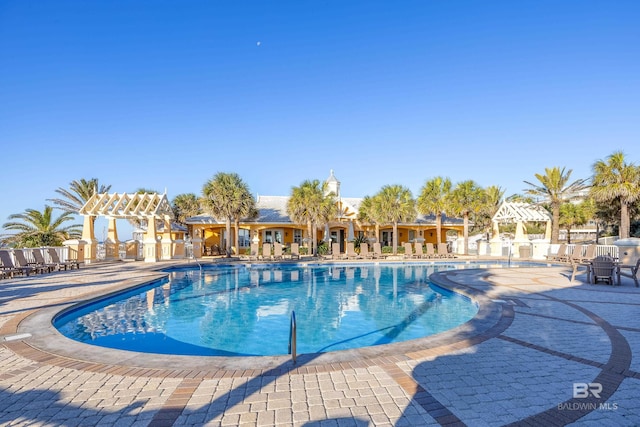 pool with a patio area and a gazebo