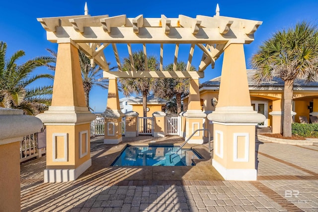 exterior space featuring a swimming pool and a pergola