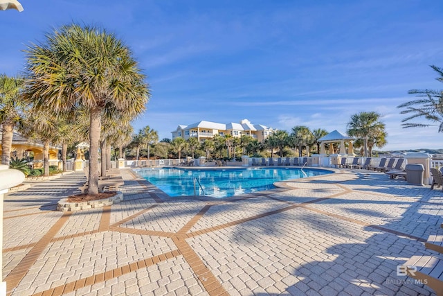 pool featuring a patio and a gazebo