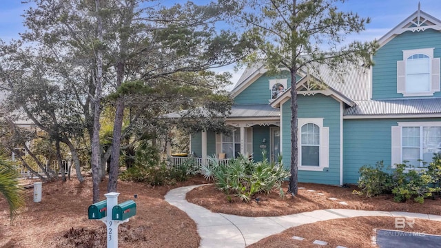 view of front of house featuring a porch and metal roof