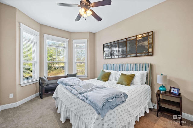 bedroom with ceiling fan and carpet