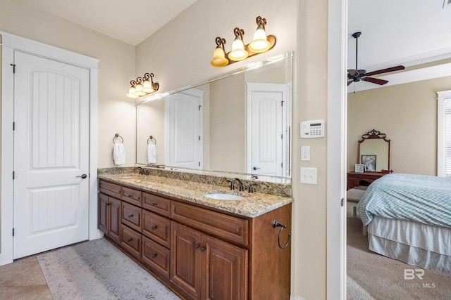 bathroom with tile patterned flooring, ceiling fan, and vanity