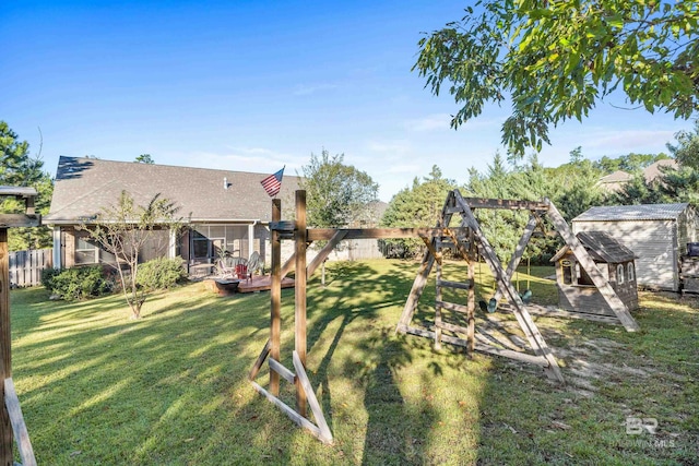 view of yard featuring a playground and a wooden deck