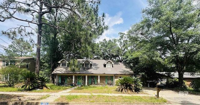 2371 Carriage Dr, Mobile, AL 36693 - view of front of property featuring a porch and a metal roof
