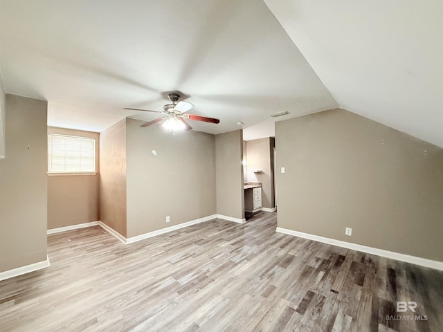 2371 Carriage Dr, Mobile, AL 36693 - additional living space featuring a ceiling fan, light wood-style flooring, and vaulted ceiling