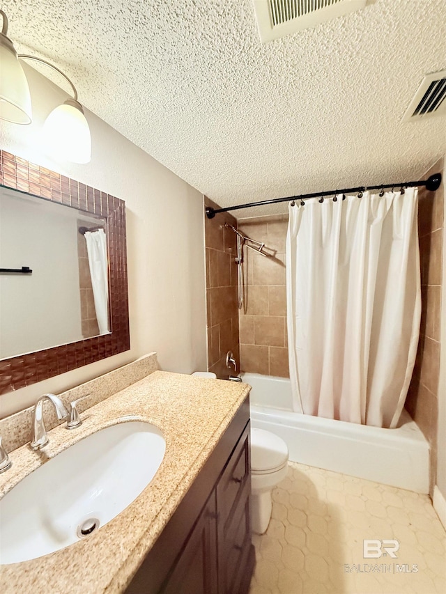 2371 Carriage Dr, Mobile, AL 36693 - bathroom with a textured ceiling, vanity, and shower / tub combo with curtain