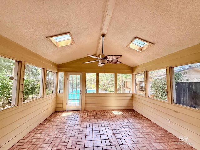 2371 Carriage Dr, Mobile, AL 36693 - unfurnished sunroom with a skylight, a textured ceiling, wooden walls, healthy amount of natural light, and brick floors