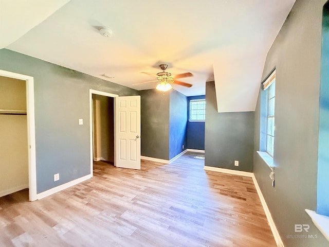 2371 Carriage Dr, Mobile, AL 36693 - unfurnished bedroom with wood finished floors, a closet, and a ceiling fan