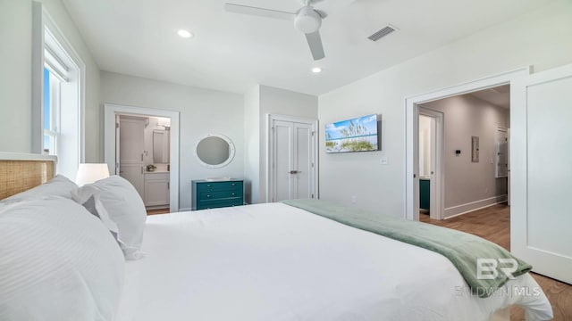 167 E J Cir, Gulf Shores, AL 36542 - bedroom featuring wood finished floors, ensuite bath, ceiling fan, baseboards, and recessed lighting