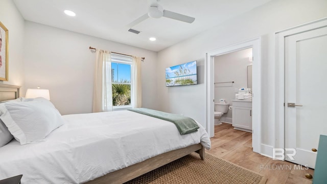 167 E J Cir, Gulf Shores, AL 36542 - bedroom with light wood-type flooring, ensuite bath, a ceiling fan, and recessed lighting