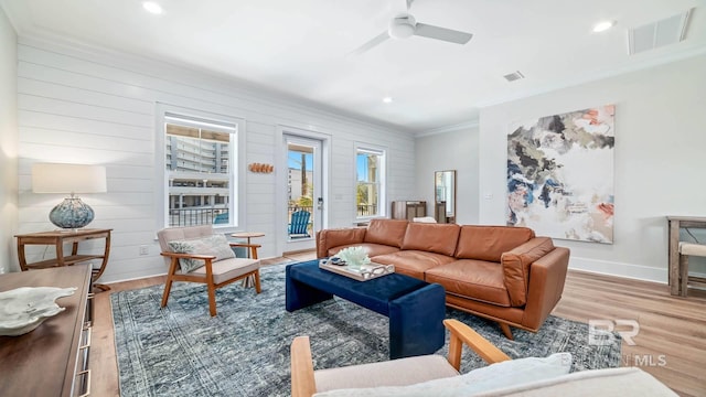 167 E J Cir, Gulf Shores, AL 36542 - living area with crown molding, wood finished floors, a ceiling fan, baseboards, and recessed lighting
