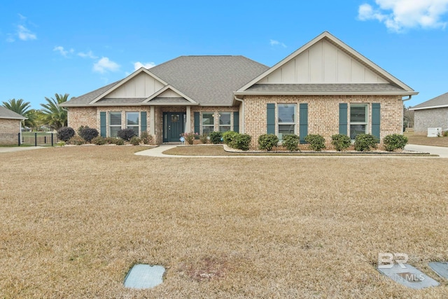 craftsman-style home with a front lawn