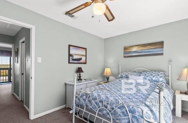 bedroom featuring dark carpet and ceiling fan