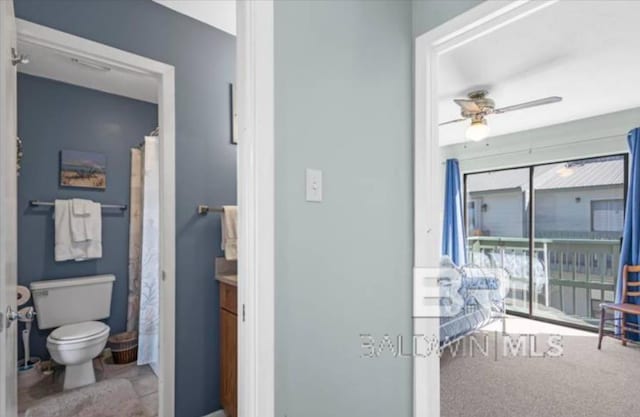 bathroom with ceiling fan, vanity, and toilet