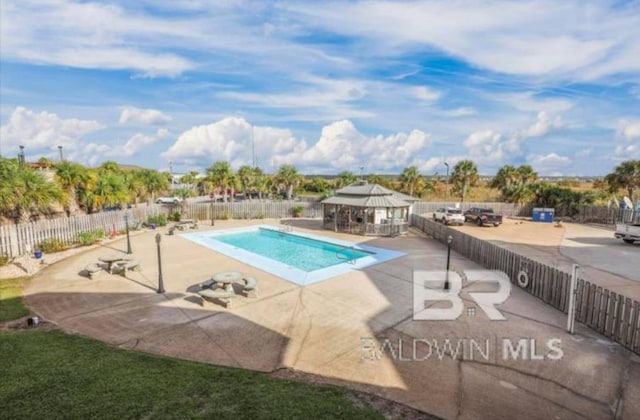 view of swimming pool featuring a gazebo and a patio