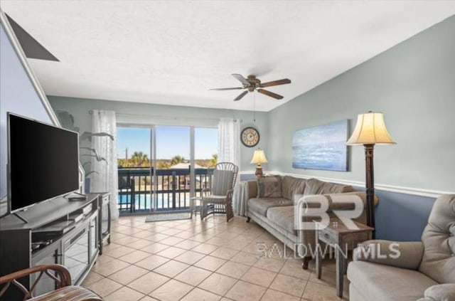 tiled living room with ceiling fan