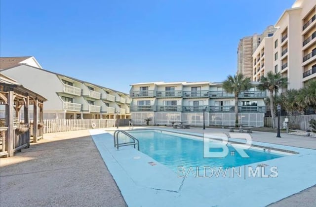 view of swimming pool featuring a patio