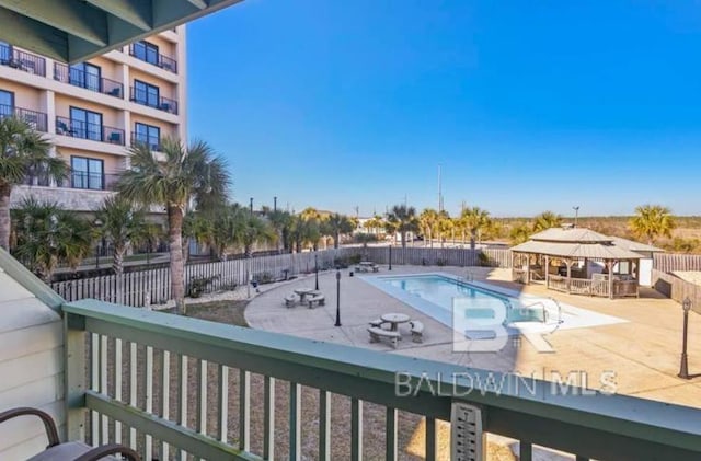 view of swimming pool with a gazebo and a patio